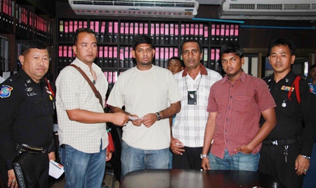 Don’t rent a jet ski from the man standing 2nd left, shown here being forced by police to hand back 25,000 baht of the 42,000 baht he extorted from Indian tourists for broken lights on his jet skis.